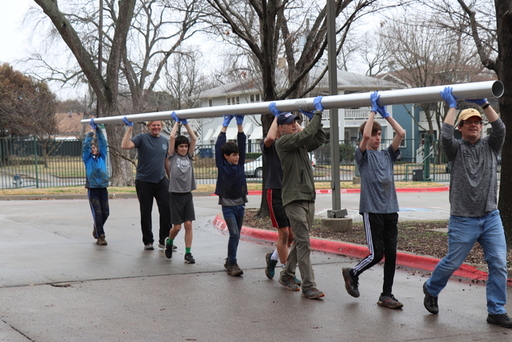 Carrying the Flagpole